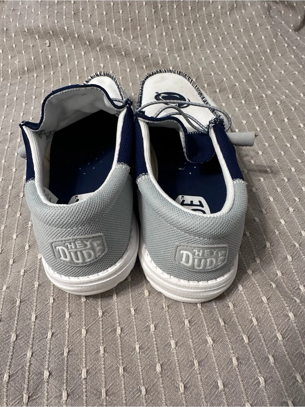Hey Dude Men’s White and Navy Slip-On Sneakers with Elastic Laces